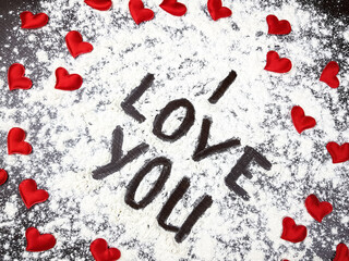 the inscription I love you. red hearts are nearby. background for valentine's day
