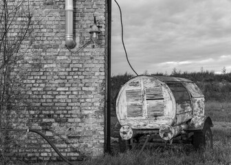 Old compressor and wall of brick building