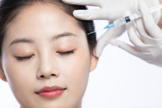 Young woman receiving Botox treatment