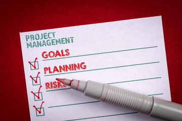 Project Management concept. Check list with text on a red background