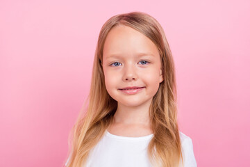 Fototapeta premium Portrait of attractive peaceful cheerful blond girl posing isolated over pink pastel color background
