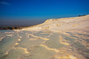 PAMUKKALE, TURKEY: Beautiful white travertine terraces on a sunny day.