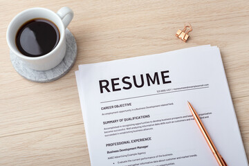 Resume with pen and coffee cup