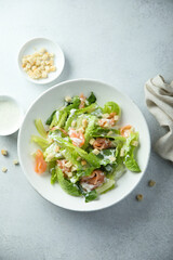 Traditional homemade Caesar salad with smoked salmon