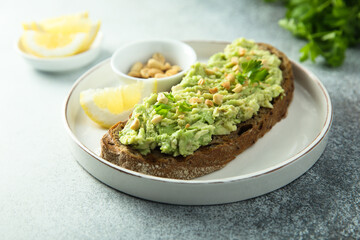 Traditional healthy avocado toast with peanut	