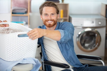 cheerful disabled man doing the washing