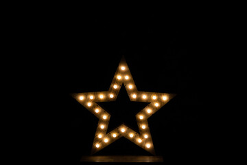 Wooden star with lights for christmas decoration