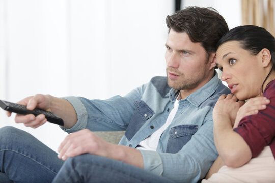 Couple Watching Scary Movie On Tv