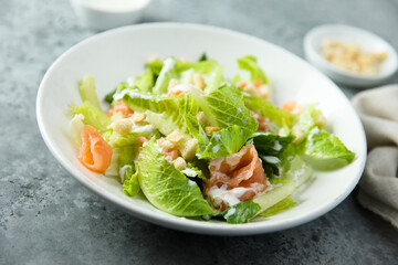 Traditional homemade Caesar salad with smoked salmon