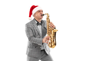 Studio portrait of musician in Santa's hat plays on saxophone on white background. New Year party 