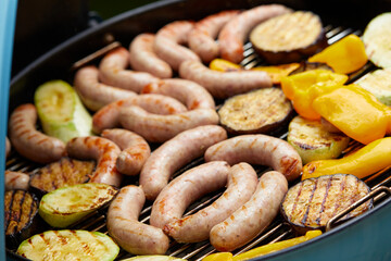 Delicious assortment of meat neck steak and vegetables grilling on a BBQ
