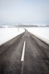  Country road in snowy winter day