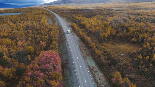 50fps drone footgage Car Camping Caravan driving road lake Swedish Lapland Sunny fall colors Abisko National Park Sweden