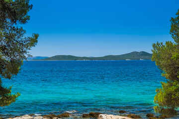 Fototapeta na wymiar Turquoise lagoon in Pakostane, on Adriatic coast in Croatia. Beautiful Mediterranean landscape. 