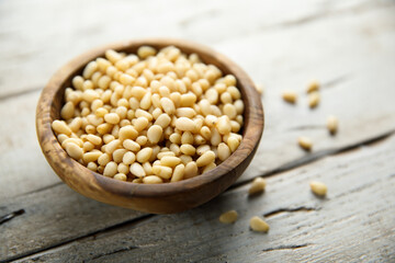 Organic pine nuts in a wooden bowl	
