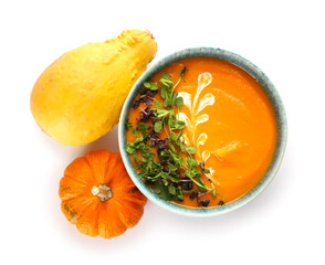 Bowl with delicious pumpkin cream soup on white background