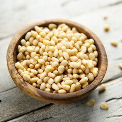 Organic pine nuts in a wooden bowl	