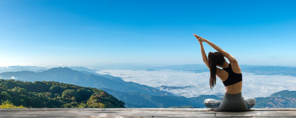 Young woman practicing yoga in the nature