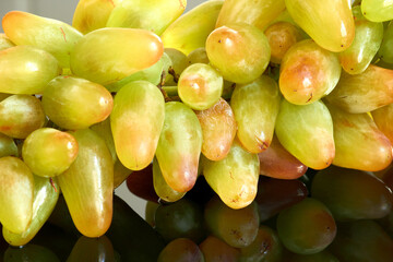 Grapes close up on glossy background