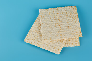 Religious matzah on the Jewish holiday of Passover, on a blue background