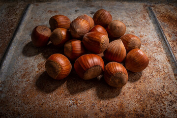 hazelnuts on a rustic background .