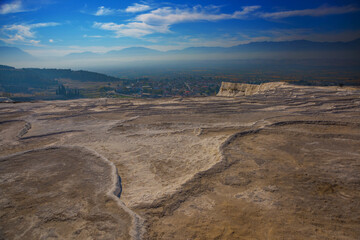 PAMUKKALE, TURKEY: Beautiful landscape with panoramic views of the white travertine and the mountains.