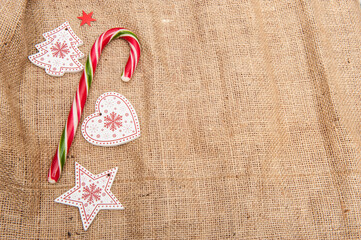 Christmas background with wooden figurines with glare and light spots, artificial snow
