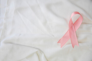 Pink ribbon breast cancer awareness, Health medical concept, satin background