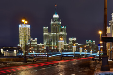 Fototapeta na wymiar Christmas Moscow. New Year's decorations on Moscow embankment. Russian city in Christmas illumination. Moscow river on a winter night
