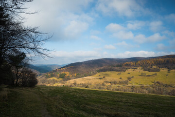 low Beskid in autumn, mountains panorama sunny weather, mountains trees clouds blue sky, end of summer in the mountains, fog mountain tourism, walk in the mountains