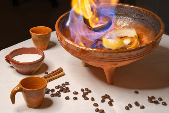 Ingredients to make a "queimada", a typical drink from Galicia (northern Spain). It is made with brandy, sugar, lemon peel, coffee beans and cinnamon and an incantation must be pronounced beforehand