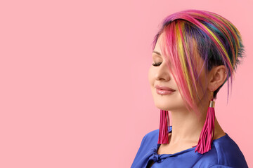 Beautiful woman with unusual hair on color background