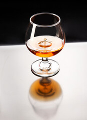 Splash in a glass of brandy. Cognac.
