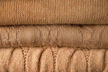 Closeup view of beige warm sweaters