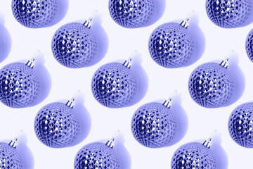 Repetitive pattern made of Christmas baubles. Monochrome composition in a purple colors.