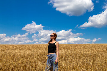Naklejka na ściany i meble person in the wheat field