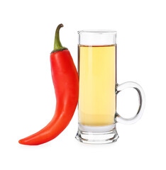 Red hot chili pepper and vodka in shot glass on white background