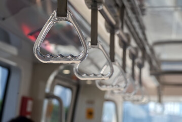 A transparent plastic handrail in a train bokey