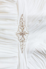 Close up of detail on wedding gown. Bridal dress