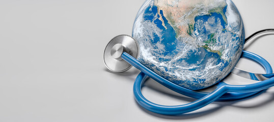 Stethoscope listening planet Earth. Global Healthcare. Stethoscope wrapped around globe on white...