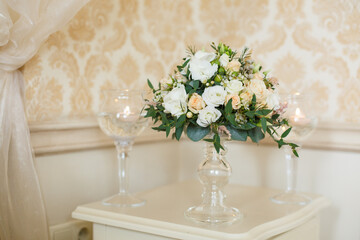 delicate wedding bouquet on room background