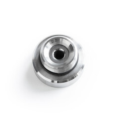 Shiny steel part, metal blank on white background. High precision steel automotive parts manufacturing by innovative CNC machining. Top view