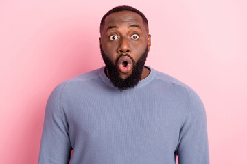 Photo of shocked amazed guy open mouth hear unbelievable news wear grey pullover isolated pink...