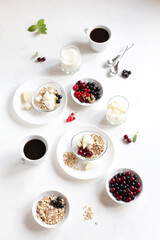Obraz na płótnie Canvas Healthy food. Breakfast, on a white table muesli with fruits and berries, drinks, yogurt. 