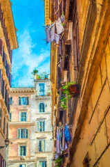 Fototapeta na wymiar Rome streets. Laundry is drying outside windows Rome, Italy