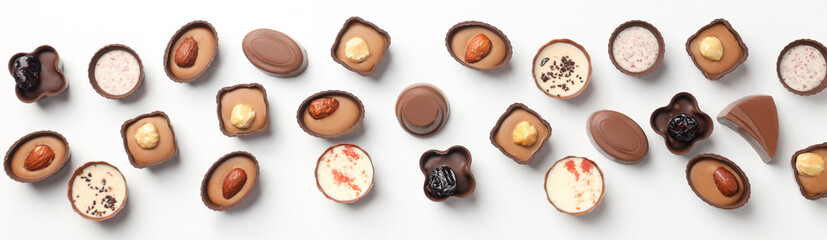 Flat lay composition with chocolate candies on white background