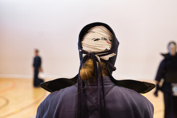 Kenjutsu Kendo Fighter in preparation for the next fight wearing traditional kendo suits