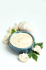 Concept of tasty food with mushroom sauce on white background
