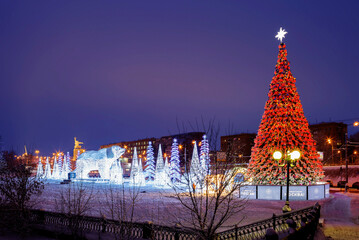 Moscow, Russia - December 14, 2021: Christmas tree and installation in Rostokinsky Aqueduct Park.
 A three-dimensional decorative installation of the bear "Umki" and a Christmas tree appeared on the R
