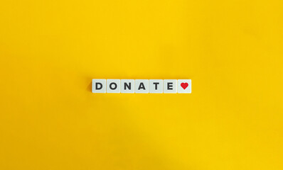 Donate banner. Block letter tiles on bright orange background. Minimal aesthetics.